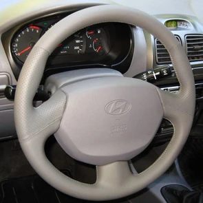{{photo.Alt || photo.Description || 'Оплетка на руль из натуральной кожи Hyundai Accent с подушкой безопасности'}}
