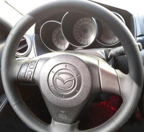 {{photo.Alt || photo.Description || 'Оплетка на руль из натуральной кожи Mazda 3-I (BK) 2003-2009'}}