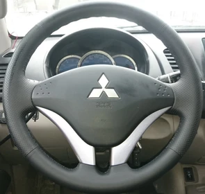 {{photo.Alt || photo.Description || 'Оплетка на руль из натуральной кожи Mitsubishi L-200 IV 2006-2014'}}