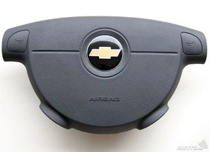 {{photo.Alt || photo.Description || 'Заглушка руля Chevrolet Aveo 2006-2012'}}