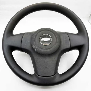 {{photo.Alt || photo.Description || 'Руль Chevrolet Niva I рестайлинг'}}