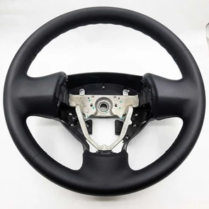 {{photo.Alt || photo.Description || 'Руль Mitsubishi Lancer X'}}