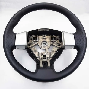{{photo.Alt || photo.Description || 'Руль Nissan Tiida'}}