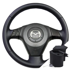 {{photo.Alt || photo.Description || 'Оплетка на руль для Mazda 3 BK (2003-2009) для замены штатной кожи'}}