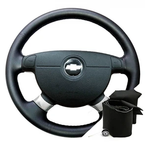{{photo.Alt || photo.Description || 'Оплетка на руль Chevrolet Aveo I (2003-2011) для замены штатной кожи'}}