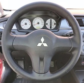 {{photo.Alt || photo.Description || 'Оплетка на руль Mitsubishi Lancer 9 (2005-2010)  из натуральной кожи'}}